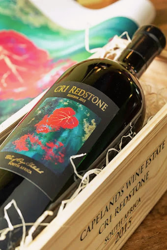 A bottle of CR1 Redstone Reserve 2015 in its wooden case