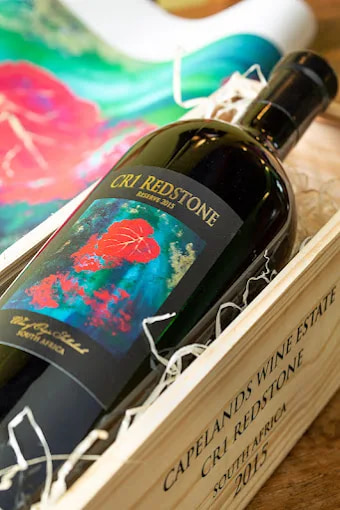 A bottle of CR1 Redstone Reserve 2015 in its wooden case